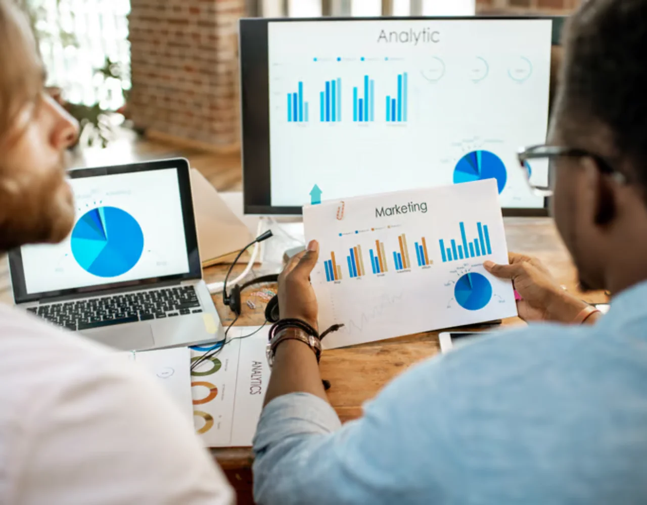 Marketing team reviewing performance charts